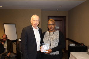 CRJ President and CEO John Larivee presents an award to Alana