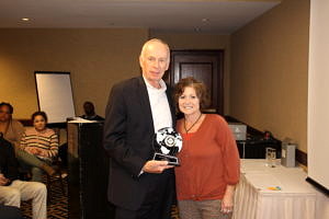 CRJ President and CEO John Larivee presents an award to Janet