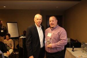 CRJ President and CEO John Larivee presents an award to Jim
