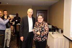 CRJ President and CEO John Larivee presents an award to Morgen