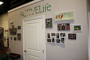 A wall of photos with Active Life stenciled above them
