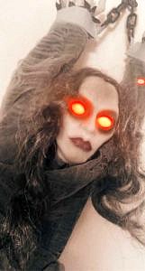A Halloween decoration in the form of a woman with glowing red eyes